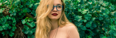 blonde girl with red lipstick and glasses